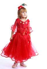 Little girl in a red ball gown.