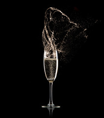 Champagne glass on black background