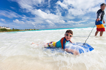 Father and son boogie boarding