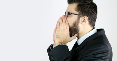 businessman screaming on a white background