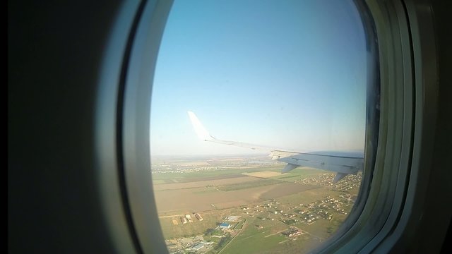 view from the porthole windows on the plane 5