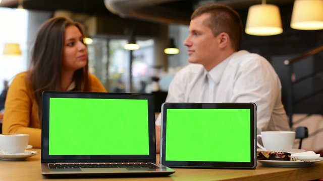 computer and tablet green screen - happy couple smiles
