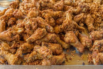 Hot fried chicken legs for sale in Thai fresh market