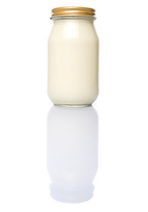 Mayonnaise in a jar over white background