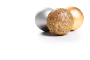 Golden Christmas spheres on the white