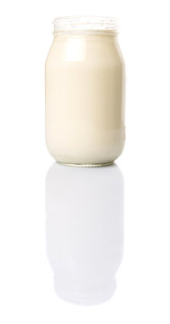 Mayonnaise in a jar over white background