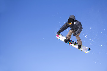 Naklejka na ściany i meble Snowboarder Jumping
