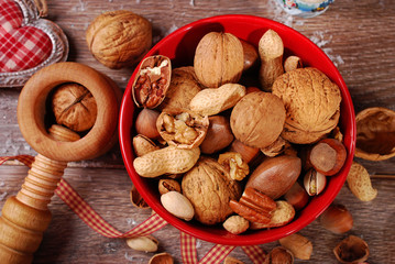 nuts assortment in bowl on wooden table for christmas