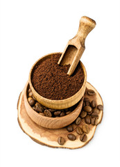 Ground coffee and beans in a wooden bowl
