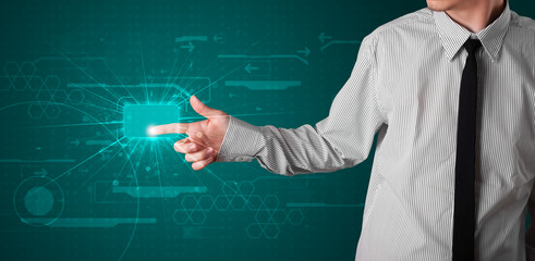 Businessman pressing high tech type of modern buttons