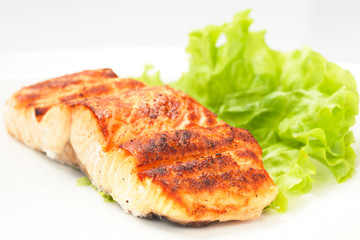 grilled salmon on white plate