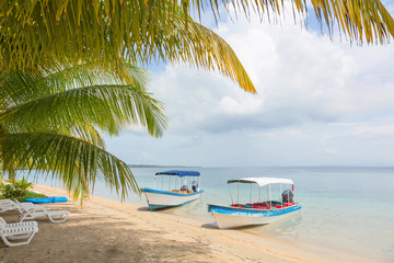 Fototapeta na wymiar Boats at the Starfish beach, archipelago Bocas del Toro