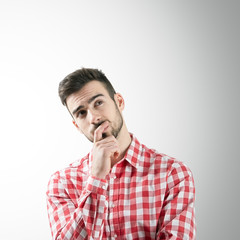 Portrait of thinking man looking up