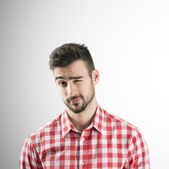 Obraz premium Bearded man wink with left eye