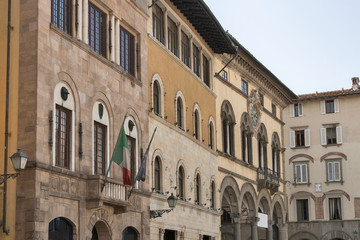 Fototapeta na wymiar Street with historic buildings in Lucca, Italy