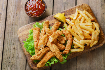 sticks breaded chicken with potatoes