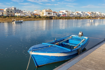 Traditional Portuguese boat at the dock. View Cabanas de Tavira.