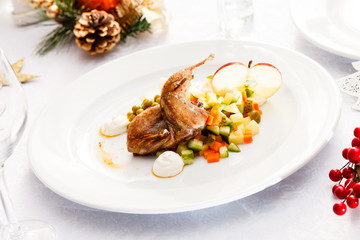 quail with salad on Christmas table