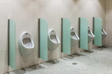 urinals in a public toilet