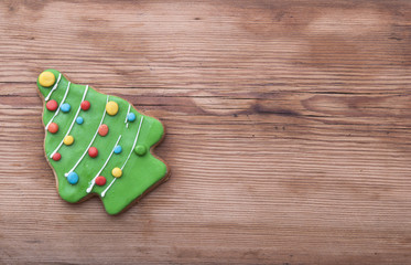 Gingerbread christmas tree on wooden background