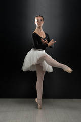 Young Ballerina Dancer In Tutu Performing On Pointes