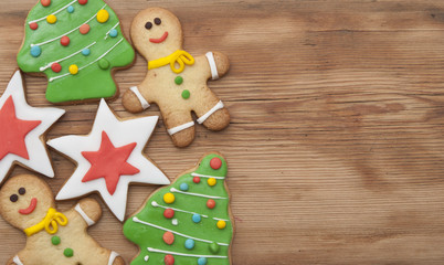 Christmas homemade gingerbread cookies on wooden table