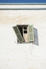 Broken window in old derelict house