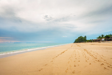 tropical beach under gloomy sky