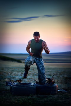 young man training outdoor in summer