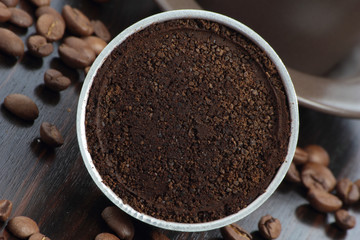 Closeup a stovetop coffee maker filter, with ground coffee.