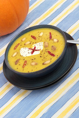 Closeup of a bowl of pumpkin soup.