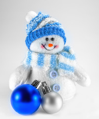 toy snowman and Christmas decorations