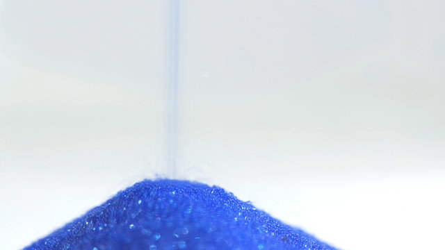 Sand running though an hourglass. 4K UHD 2160p footage