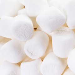 ..A pile of  Delicious mini White Fluffy Round Marshmallows on w