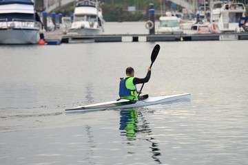 man kayaking in the sea