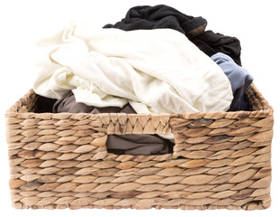 laundry in a wooden knitted basket isolated