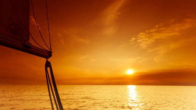 Fototapeta Yachting yacht sailboat in baltic sea at sunset sunrise.