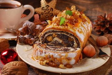 poppy seed cake and coffee for christmas on wooden table