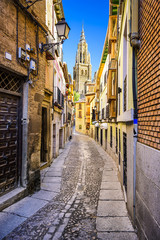 Toledo, Spain Alleyway viewing Toledo Cathedral - obrazy, fototapety, plakaty