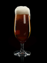 Glass with foamy beer