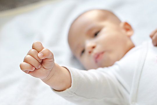 Battle for babies,strong baby showing fist
