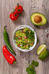 Guacamole with avocado, lime, tomato and cilantro