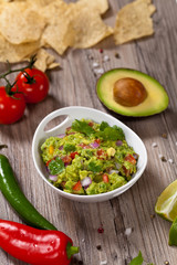Guacamole with avocado, lime, tomato and cilantro