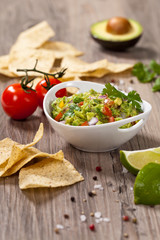 Guacamole with avocado, lime, tomato and cilantro