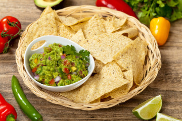 Guacamole with avocado, lime, tomato and cilantro