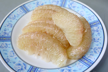 fresh grapefruit on dish.