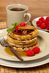Waffles with raspberries and cinnamon. Selective focus.