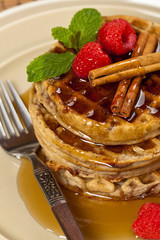 Waffles with raspberries and cinnamon. Selective focus.