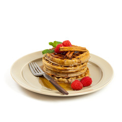 Waffles with raspberries and cinnamon. Selective focus.