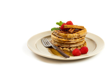 Waffles with raspberries and cinnamon. Selective focus.